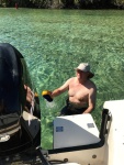 Colby cleaning the boat in Silver Glen Springs