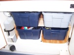 Under Sink Storage Totes. We can pile a lot of stuff in the totes and still keep it fairly organized. Also allows us to pack them in the house and then carry them out to the boat when getting ready for a voyage and returning.