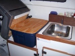custom made cutting board fits on top of tote for more counter space.