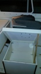 Storage box lid is mounted on hinges and much easier to access.