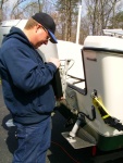 My buddy Charlie, a professional boat mechanic.  We need to make sure that there is clearance between the main and the kicker.