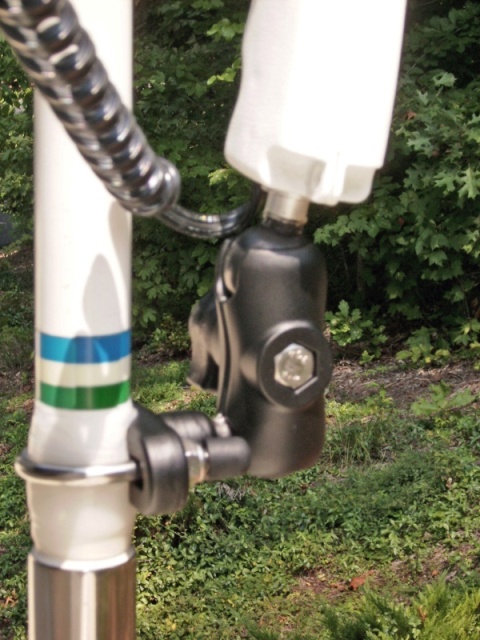  Close up of RAM mount, stainless U bolt, short handle, and ball with threaded shaft to fit threaded insert on bottom of Optronix handheld spotlight (3/8 x 16 thread). RAM also offers the ball with a 1/4 x 20 camera tripod thread) Antenna is wrapped a few wrappings with clear Rescue Tape.