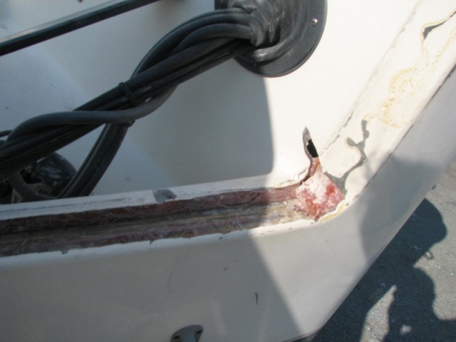 Final clean out of transom on stb.  Note the hole all of the way thru the splash pan--This is where the cracks are developing in the side of the transoms, and the load is transfered there inside of to the side of the hull as is proper.