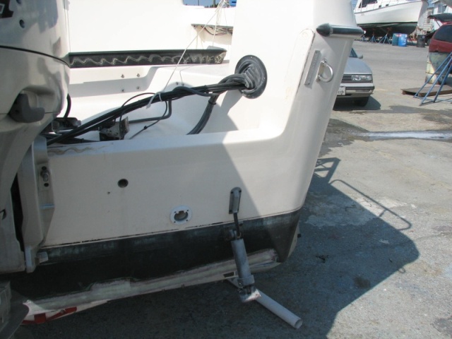 Transom, just before compounding at transom corner and final epoxy coat on bottom of transom, where Transducer starboard block will be screwed into solid glass