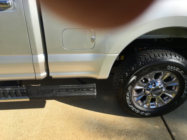 Running board extends all of the way to aft fender, and one can also put a foot on top of the tire if necessary when fueling aux tank.  