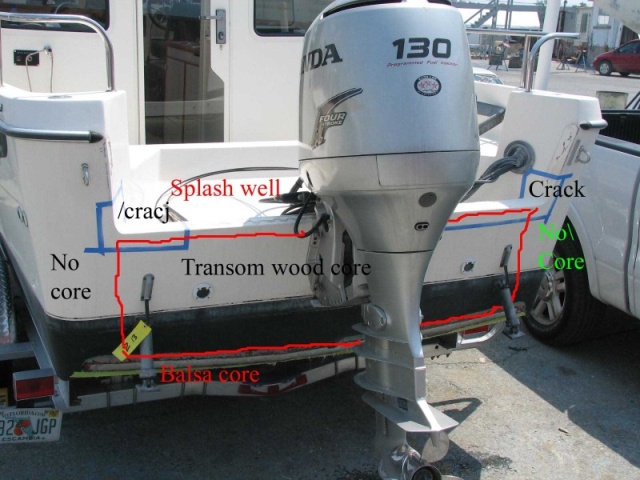 Photo outlining the part of the transom backed with wood.  Cracks in to the splash well area from the top of the transom. Areas or repair deliniated in masking tape.