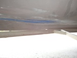 area where bottom paint worn off by trailer bunk loading