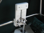 Bracket for dinghy outboard on railing in cockpit