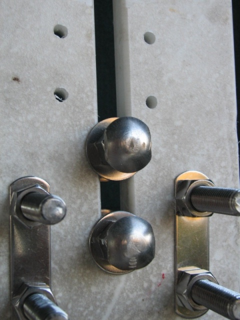 detail of squared off head of outboard bracket , with U Bolts in place for railing mount