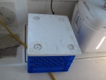plastic crate under generator