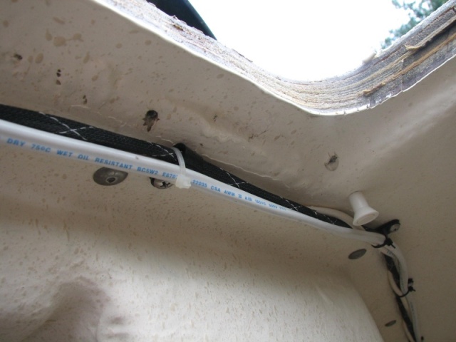 Two trim screw holes where water was comming thru the deck from hatch lack of bedding