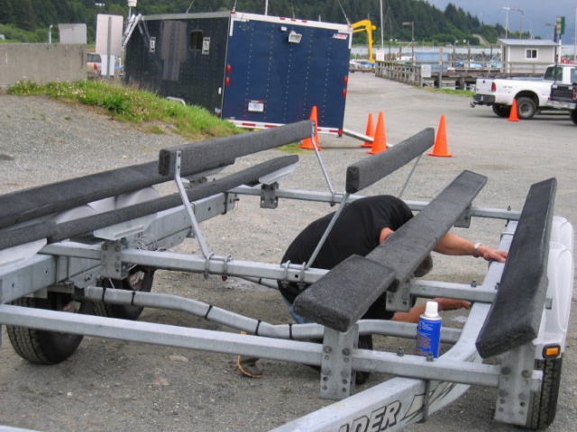 Moving the axles on my trailer to the max forward postion just after purchasing the boat.  This is before I cut the tops off the U-bolts that were gouging the hull and before I moved the bunks back closer together that the previous owner had spread apart.