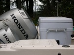 Image showing cooler in relationship to engines in maximum up-position.  Note placement of cutting board on top of cooler for bait cutting.   