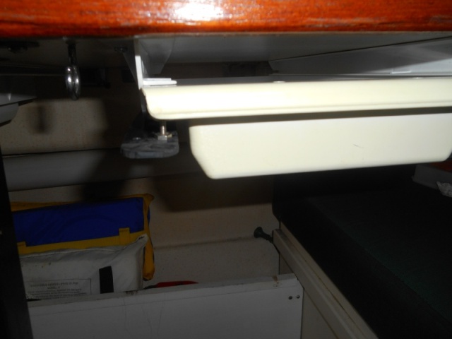 The drawer is the common plastic RV one that I see on many boats.  Easy to mount, works great, but no latch. I got tired of my bungy cord stop gap method.  Here, you push down the latch with your thumb as you pull out the drawer.  It latches when you return the drawer.