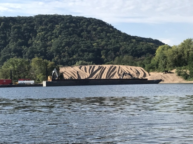 This is what they do with the sand that is dredged up.  New playground for boaters!