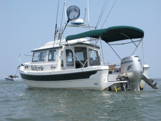 Anchored off East Harbor State Park in three feet of water for a swim to the beach.