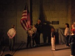 Scouts lowering and folding the flag at Mt. Rushmore evening ceremony.