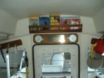 Teak book rack over the door, making use of the high-top's extra space.