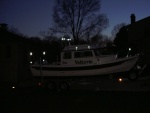 Reflective tape (ACR) added to make vessel more visible when anchored at night or when in distress.  A package of 12 sheets ($25 at West Marine) will do the whole boat.  Tape was added to bimini frame, radar arch, cabintop handrail supports and bow pulpit.  Highly effective at night, but not noticeable during the day.