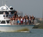 Spring break crowd dancing on the bow