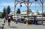 Watching boats being loaded on a truck at the factory...