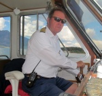 At the helm of the cruise boat