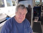 Dave Deem and my wife Ginny in the reflection in the rear door rafted up to Alma's Only and Knot Flying in Isle Au Haut Maine 2010