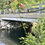 The crew measuring the clearance under the dread Smith River Bridge--white tape marks the 5'3