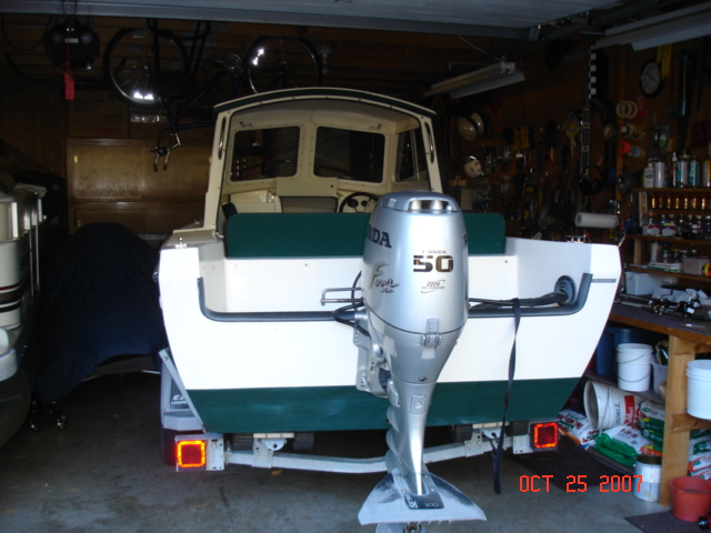 CD-16 Angler squeezed into packed garage for wtr07-08 - back on the water as soon as ice is out!