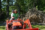 (Otter-BelleHavenMarina) Grace gets a turn on the tractor