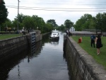 a boat coming into a dock while we are waiting to go the other way.  Notice the straps on the walls that you tie up to to secure the boat when the water comes in or goes out.