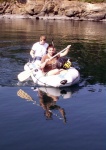 Conor, Lydia and Baxter in Dinghy at Clark  Island 8-13-06