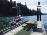 Often the only boat on the dock here. All dressed up for company and watching the morning breeze.  Can almost set your watch by it, 10AM.