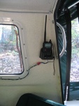 Installation for Standard Horizon HX471 handheld VHF with DSC. Cradle keeps radio close to my ear, connects to GPS for positioning and can be plugged in for charging at any time.