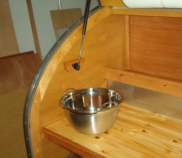 Sink made from 2 bowles. One is bolted down and the other fits into it. Add handles, Simply pull out and dump. 
