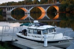 Town of Minetto town dock.  Power advertised, but not turned on.  Orange on bridge behind us is setting sun on under side of bridge.