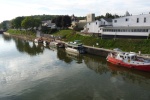 Lyons, NY. Two Bears is the 2nd boat from the left on the lower floating dock. Many small towns on the western end of the canal provide a low floating dock suitable for small boats.  They also often provide power and restroom facilities.  In this case we used the fire hall which is the left end of the white building.  Being an old volunteer fireman, Chuck had a good time visiting with the volunteers that staff the station. 