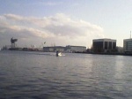 Little Tug steaming north with the Norfolk Naval Shipyard in the background