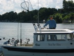 (Not For Hire) Boat at dock showing radar arch and rod holders, etc.