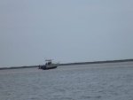 notice red marker on the other side of their boat he is facing the inlet,he is On the wrong side of the tracks!Tide still going out he's going to be there a  while. Near Holgate New Jersey, Little Egg Inlet May 1, 2011