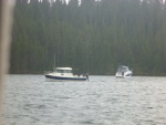 Phil Parsons one of the fishing guides for hire at Jackson lake coming in after getting drenched in an afternoon thunder storm. He is a great guy who offered us everything from watching TV on his boat to lending me a complete dipsy diver fishing rod setup.