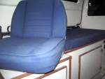 Swivel seat.  Also gain of one inch in height.  (with hidden galley same height as helm seat, swivel works great)