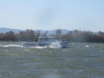 Steve (sea spray)  duking it out in the San Jaquin river in 25 plus and 3 footers following a ship.  Dusty afternoon.  photo from Kerri On