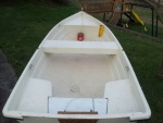 Bow and stern corner seats are sealed with foam floatation and center bench is just an upside down U of fiberglass.  Rear center board lifts out without fasteners