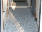 Removable marine grade berber carpet. Very easy to clean. Very durable. Keeps boat a lot cleaner, warmer, and quieter.
