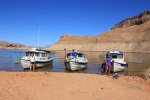 The Admirals next to their boats.