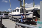 Jacking up back of boat for sling launch strap