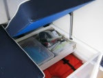 Forward seat storage with slidable tray slid bag. Very handy!!