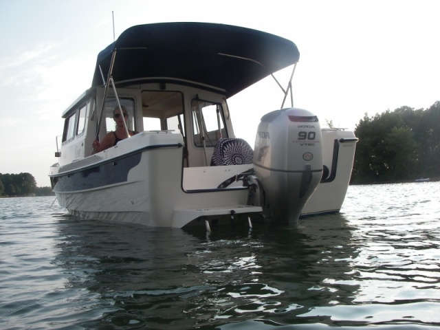 Loving the SHADE,and occasional showers make the boat much more versatile.