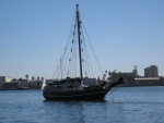 steel replica of Slocum's Spray   folks came over to greet us when they saw our home port Nanaimo.. they cruised there on a Pacific voyage